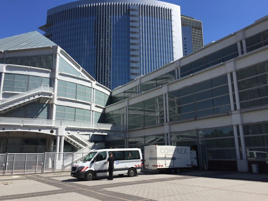 A man standing in front of a building.